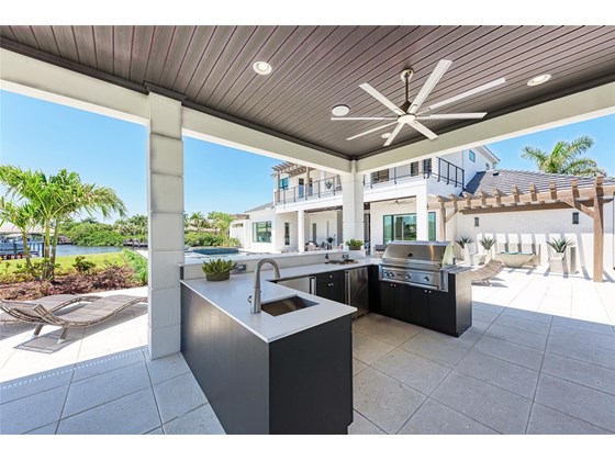 Cabana includes full outdoor kitchen, perfect for entertaining your family and friends! - Single Family Home for sale at 602 Regatta Way, Bradenton, FL 34208 - MLS Number is A4499642