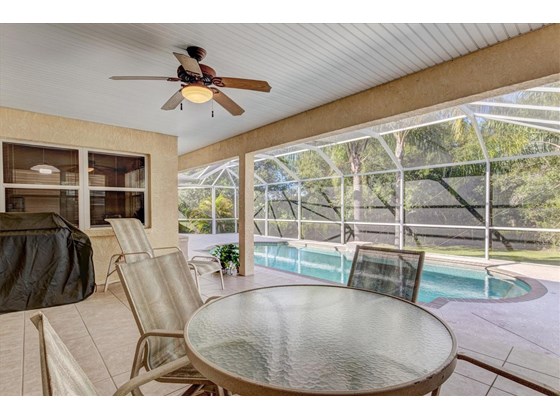Covered pool area off the family room - Single Family Home for sale at 1518 Bel Air Star Pkwy, Sarasota, FL 34240 - MLS Number is A4506654