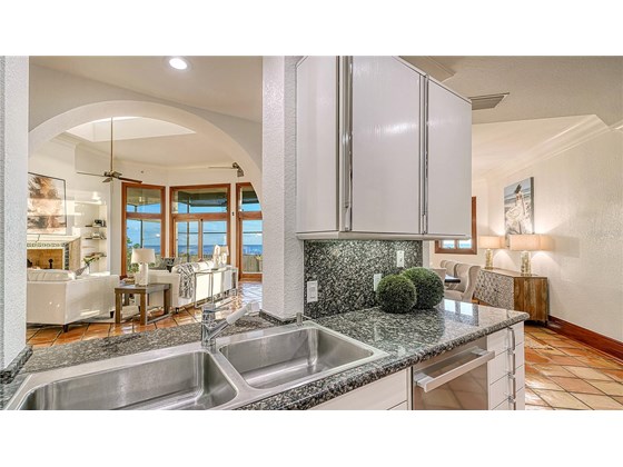 Kitchen with open view of great room - Single Family Home for sale at 6211 Gulf Of Mexico Dr, Longboat Key, FL 34228 - MLS Number is A4511733