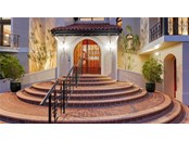 Steps to the entry with gated arched doors - Single Family Home for sale at 6211 Gulf Of Mexico Dr, Longboat Key, FL 34228 - MLS Number is A4511733