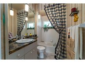 Third Bath directly next to fourth bedroom enjoys its own linen closet. - Single Family Home for sale at 6521 Sundew Ct, Lakewood Ranch, FL 34202 - MLS Number is A4514104