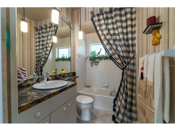 Third Bath directly next to fourth bedroom enjoys its own linen closet. - Single Family Home for sale at 6521 Sundew Ct, Lakewood Ranch, FL 34202 - MLS Number is A4514104