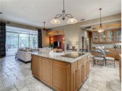 An abundance of space in this kitchen to prepare food or to sit around kitchen island and talk with the chef - Single Family Home for sale at 319 Stone Briar Creek Dr, Venice, FL 34292 - MLS Number is A4522164