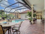 Oversized lanai in this courtyard has travertine pavers....awesome! - Single Family Home for sale at 319 Stone Briar Creek Dr, Venice, FL 34292 - MLS Number is A4522164