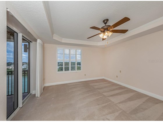 Master bedroom with slider to the balcony - Condo for sale at 147 Tampa Ave E #702, Venice, FL 34285 - MLS Number is N6116949