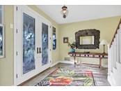 Step inside! Amazing front doors! - Single Family Home for sale at 6751 Portside Ln, Englewood, FL 34223 - MLS Number is N6118322