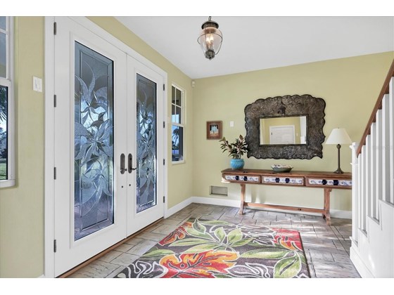 Step inside! Amazing front doors! - Single Family Home for sale at 6751 Portside Ln, Englewood, FL 34223 - MLS Number is N6118322